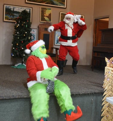 Grinch snuck in to try to steal the show from Santa at the Christmas Market held at the Red Willow