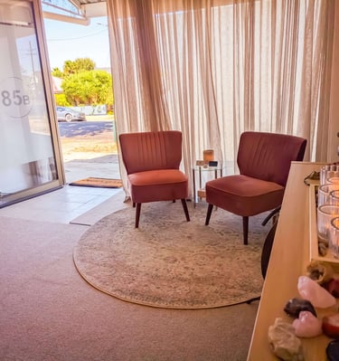 Comfortable, pink, velvet seating at the Sacral Space Clinic. 