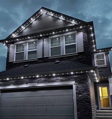 Elegant white LED permanent lights outlining a residential house exterior.
