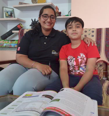 a woman and a boy sitting on a couch