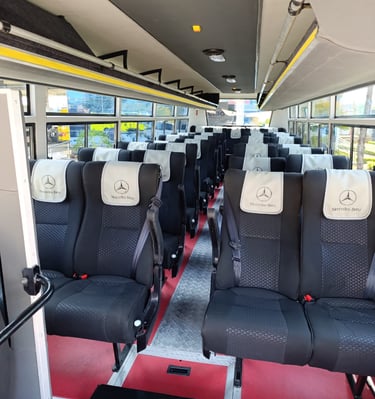Interior of a luxury Mercedes-Benz bus available for hire for short & long distance trips