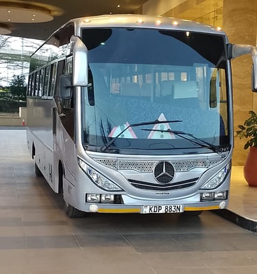 Mercedes-Benz luxury tour bus for passenger shuttle service for hotel guests in Nairobi.