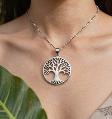 Soft natural light illuminating a silver necklace with jade accents on a dark green background.