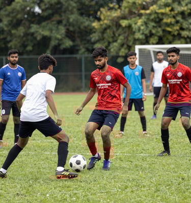 Close-up of an Indian student studying with a laptop and textbooks in a modern library.