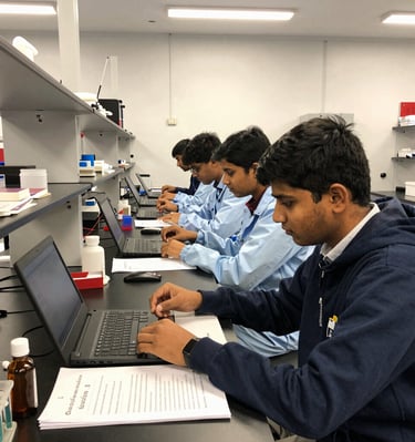 An Indian student with a backpack walking confidently on a vibrant university street.