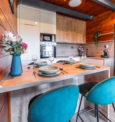 a kitchen with a table and chairs and a table