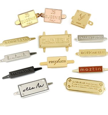 Elegant and polished branded metal hardware for premium custom bags, made by King Fly.