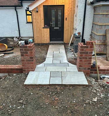 brick wall being built at a malvern home