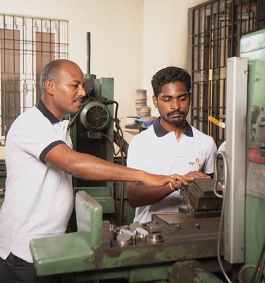 MP Asia Engineering staff working on CNC machine