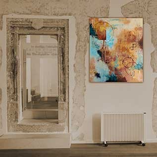 Abstract painting in siennas and blue-greens on a distressed-textured wall next to a door