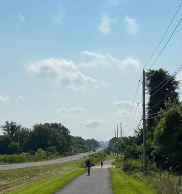 a person riding a bike down a trail