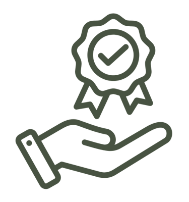 a hand holding a certificate with a green ribbon around it