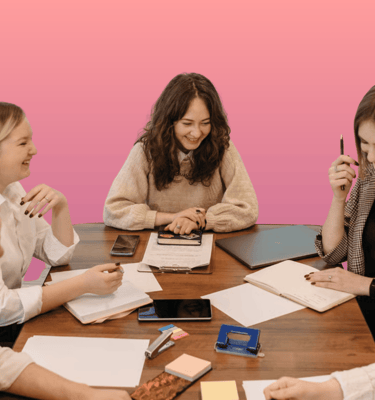 a group of people sitting around a table