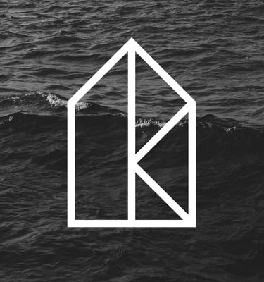 a house with a white house in the middle of the frame