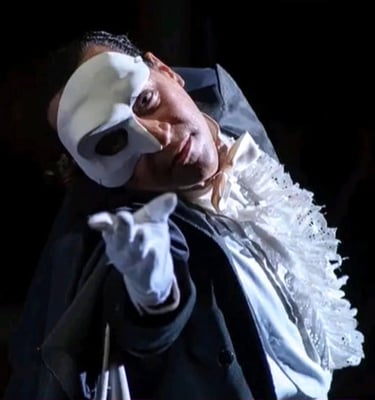 a man in a white mask and a mask on his face