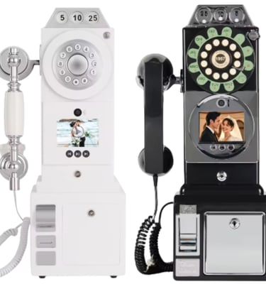 Payphone-style audio guestbook phones in black and white with digital screens for wedding messages.