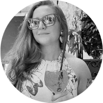 a woman in sunglasses and sunglasses with a guitar