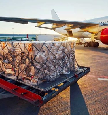a cargo plane with a cargo truck loaded with cargo