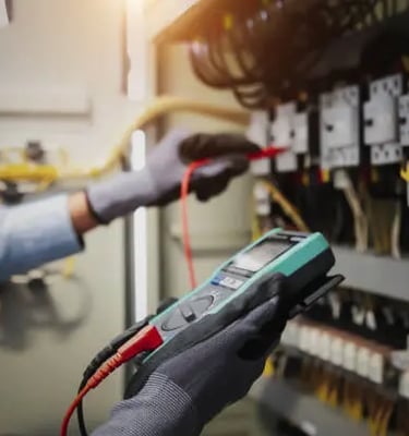 a man in gloves and gloves holding a multi - function metered metered meter