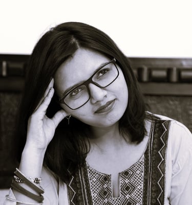 a woman in glasses gazing to the distance