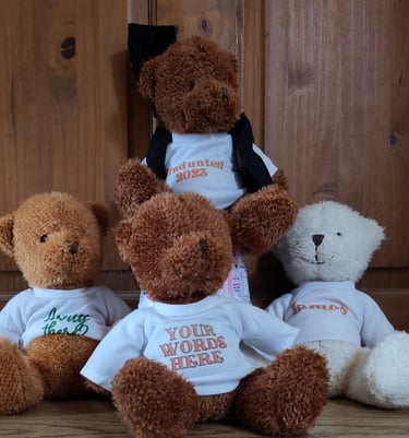 a group of teddy bears sitting on a wooden floor