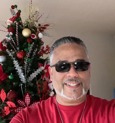 a man with sunglasses and sunglasses on a christmas tree