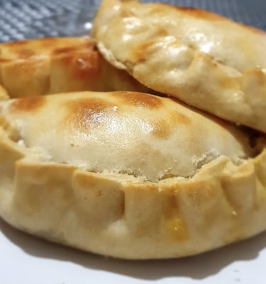 a plate of food with a pastry on it