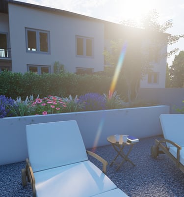 a patio with two lounge chairs and a hat on