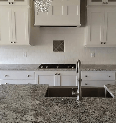 a kitchen with a sink and a chandelier