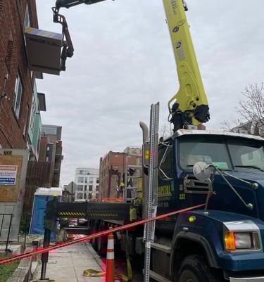 a crane truck with a crane on it's side