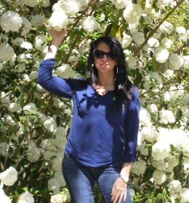 Yvette - model,enclosed,in,virburum,white,blooms, Marnolia+Plantation,