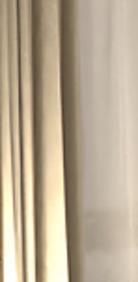 a living room with a dining room table and chairs