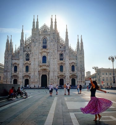 Woman twirling in front of the Duomo di MIlano
