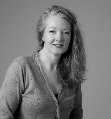 A photograph of author Alex Greyson