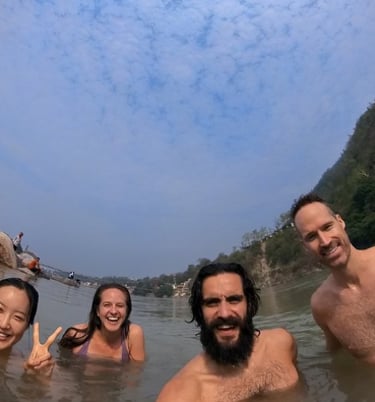 Group of friend having a bath on the Ganges River.