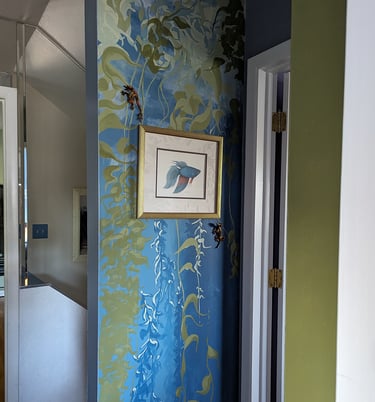 Accent wall mural of 8 by 3 feet in size of a sea kelp forest. Painted in colors to accent a favored hanging watercolor.
