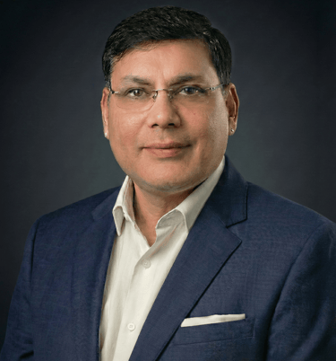 Portrait of Ruchir Saurabh, Senior Enterprise Leader, wearing professional business attire.