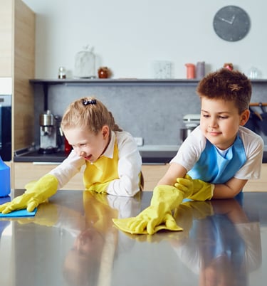 children helping clean the kitchen