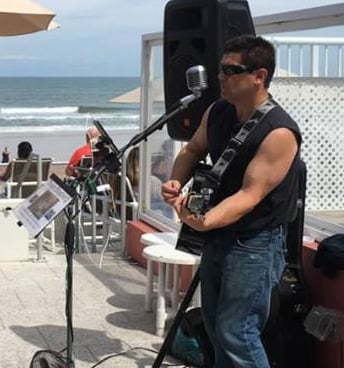Thom Blasberg playing guitar and singing in Ormond Beach FL