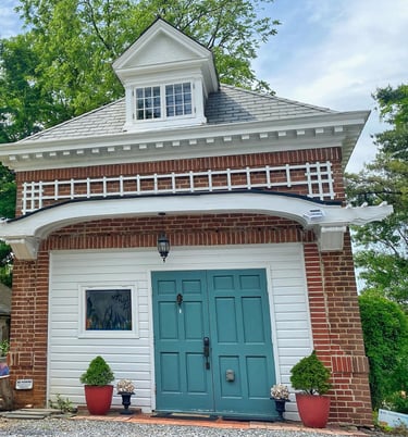 2123 rivermont carriage house with green door and white awning