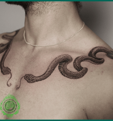Realistic symmetrical snake tattoo on the chest by MaxDuong Tattoo in Da Nang