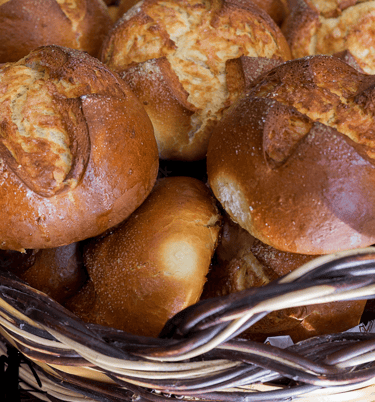 a basket of breaded rolls in a basket