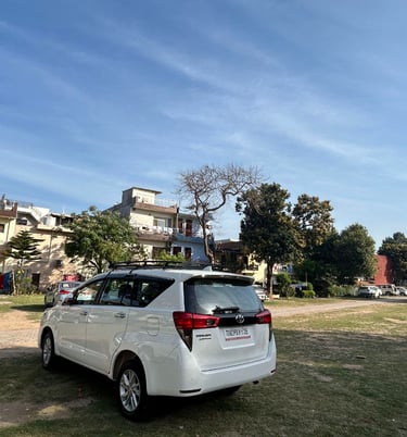 a white van parked in a grassy area