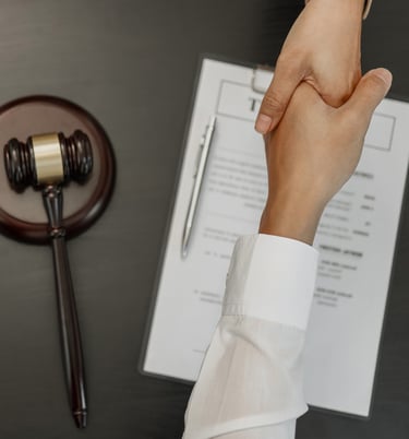 a person holding a hand and shaking hands