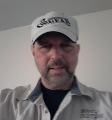 a man in a white shirt and a white hat
