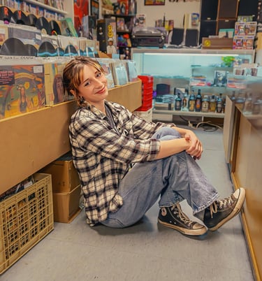 Senior pictures in a record store by Lititz PA senior picture photographer. Senior Rep Team Lancaster PA