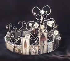 a crown with art supplies on top