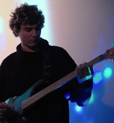 a man playing a guitar on stage