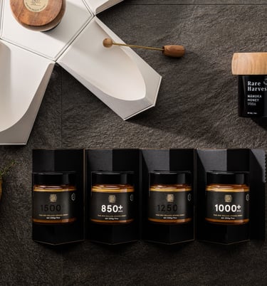 Product photography - a variety of honey products styled on a stone tile