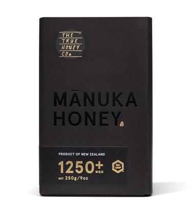 Product photography - a black box with a jar of honey inside